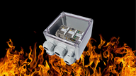 A polycarbonate enclosure fitted with ceramic terminals marked Fire Rated.